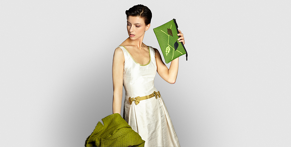 {image descriptor (model in white dress holding)],[Name of collection item], [type of bag], [colour], [Kamera Obscura]